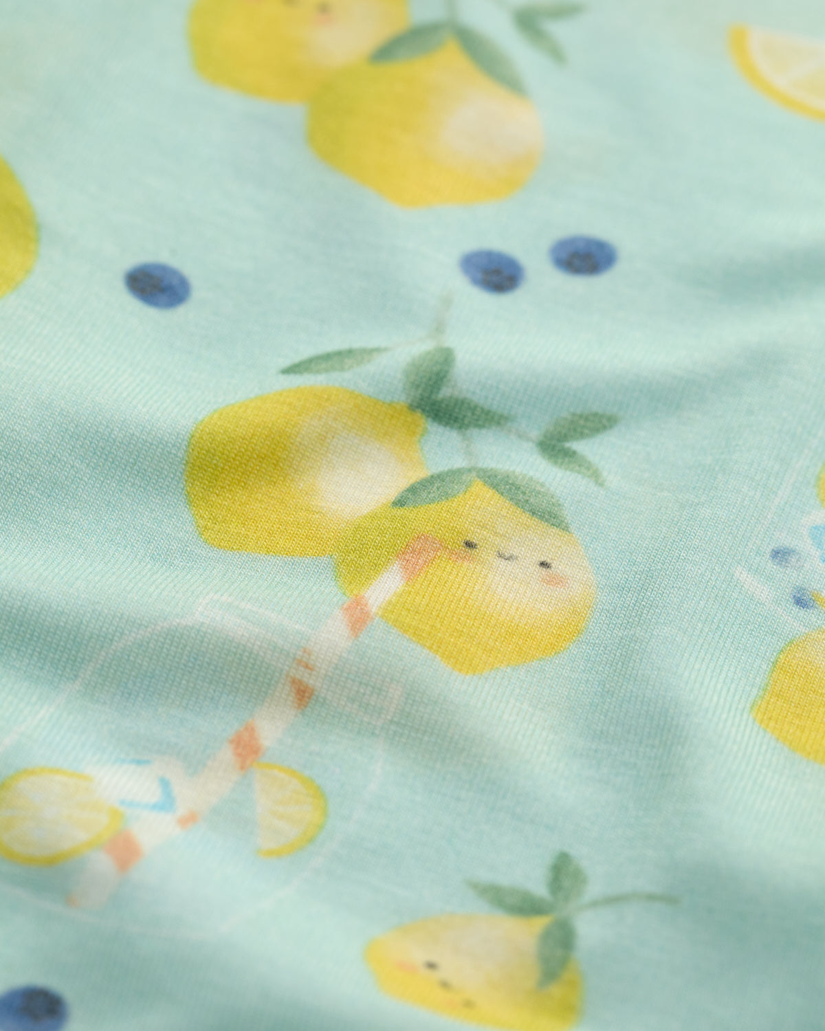 Fabric with lemon pattern on a light green background