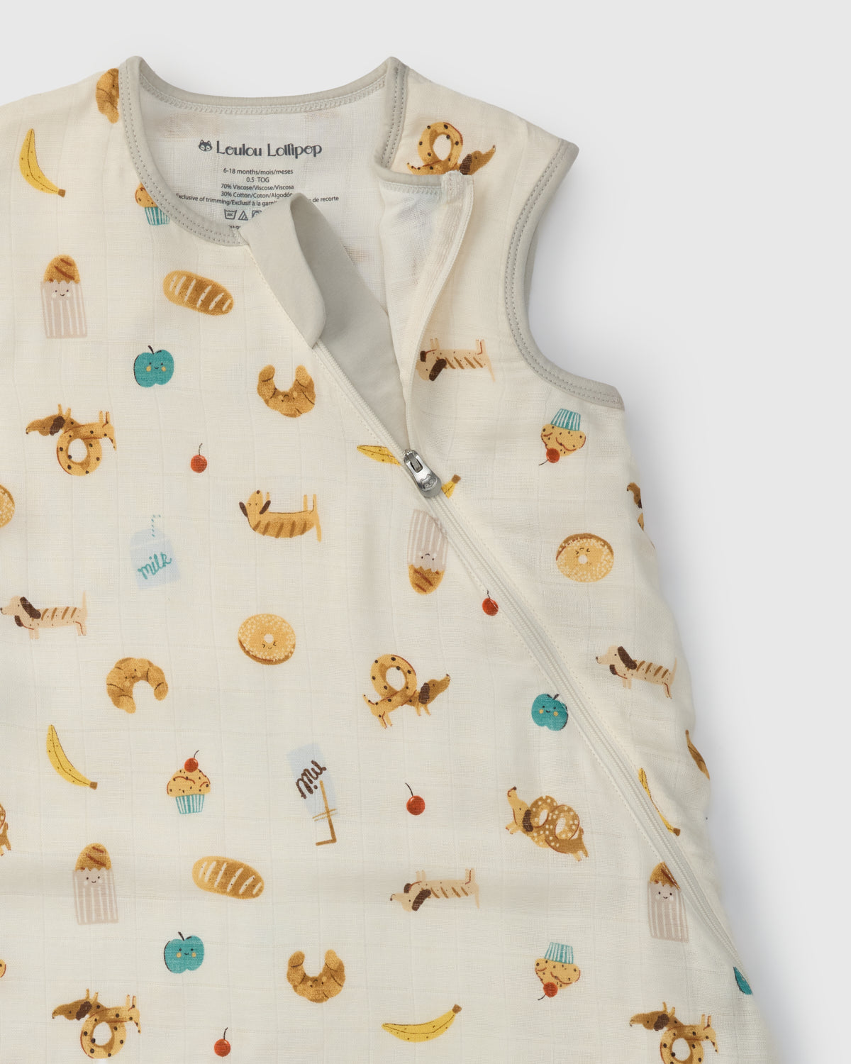 Baby sleep bag with food-themed pattern on a white background