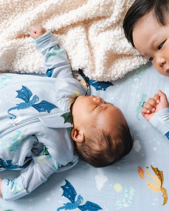 Baby in Sleep Sack with Big Brother in Sleeper in Magical Dragons print.