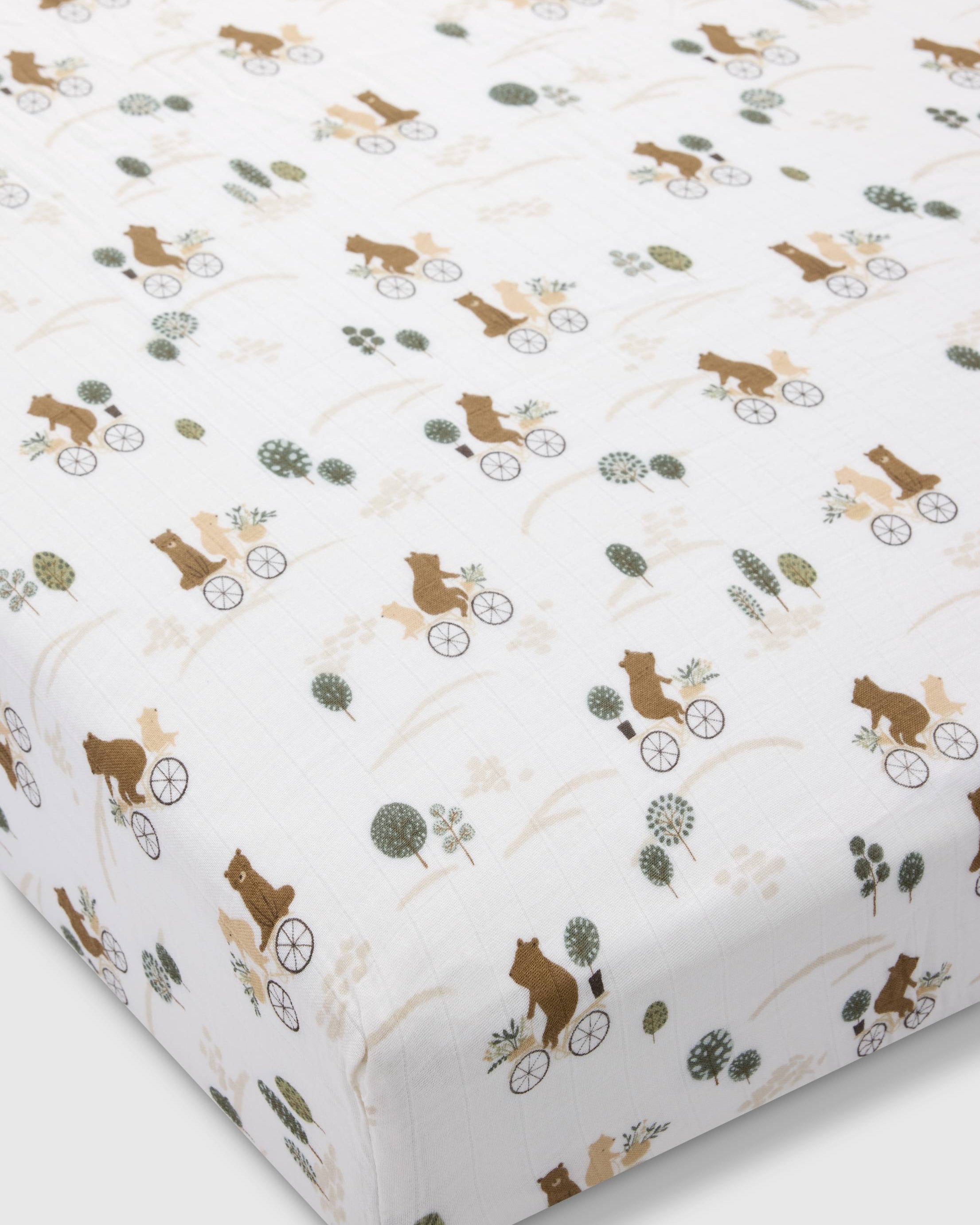 Loulou Lollipop muslin fitted crib sheet in Bears on Bikes for US standard crib — front view on white background