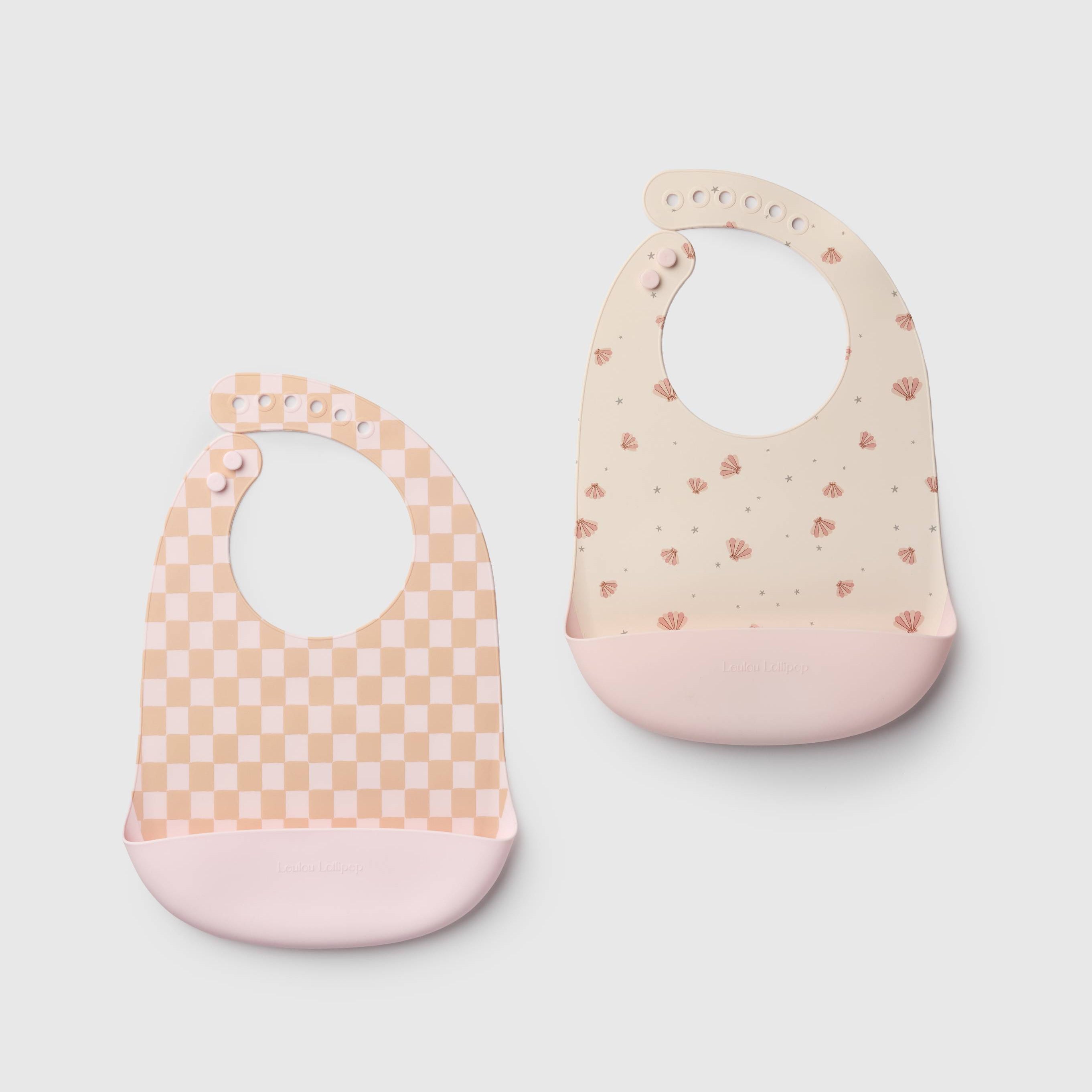 Loulou Lollipop FDA-compliant food-grade silicone baby bib set in Seashell and Pink Checkerboard - front view on white background