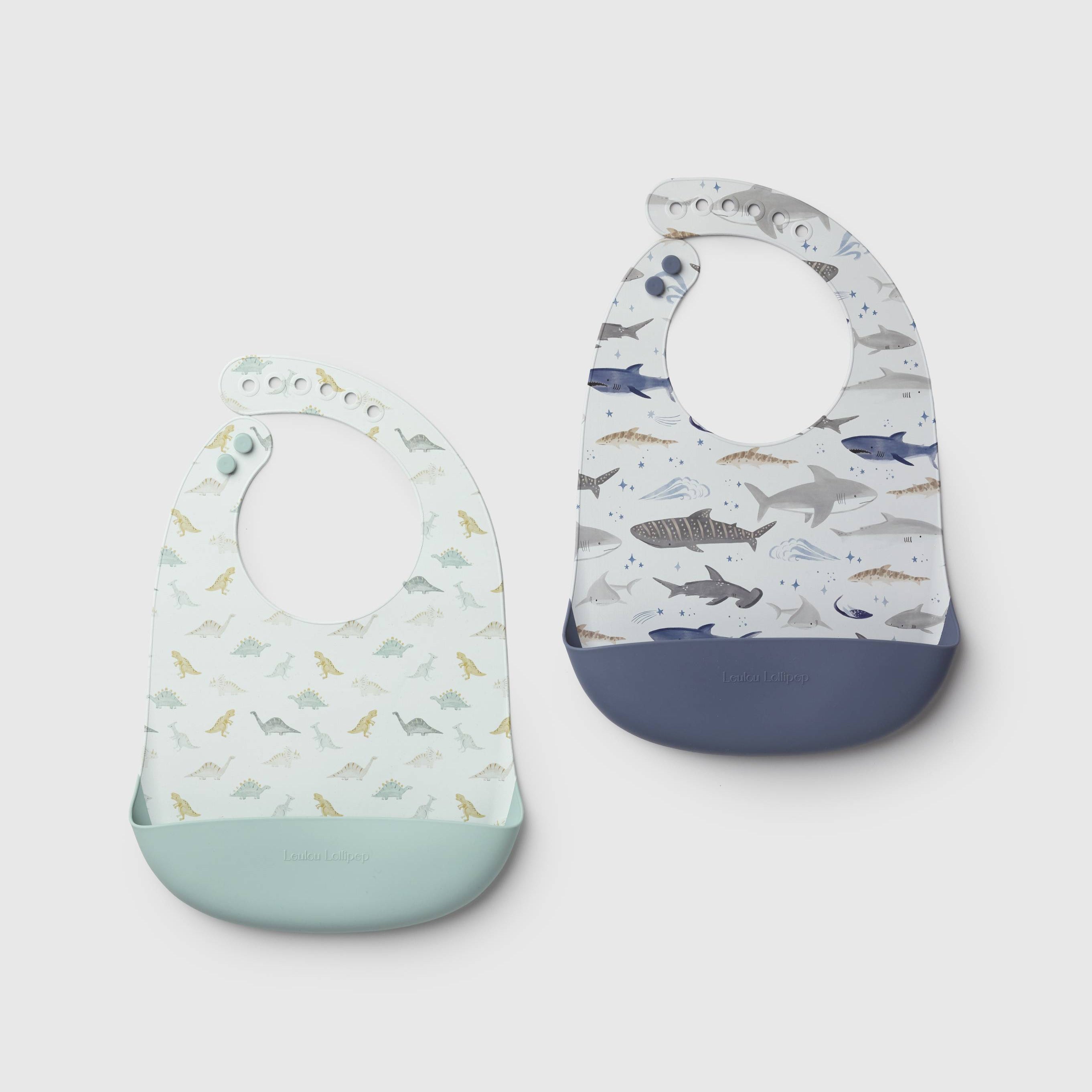 Loulou Lollipop FDA-compliant food-grade silicone baby bib set in Smiley Sharks and Dinosaurs and Neutral Checkerboard - front view on white background