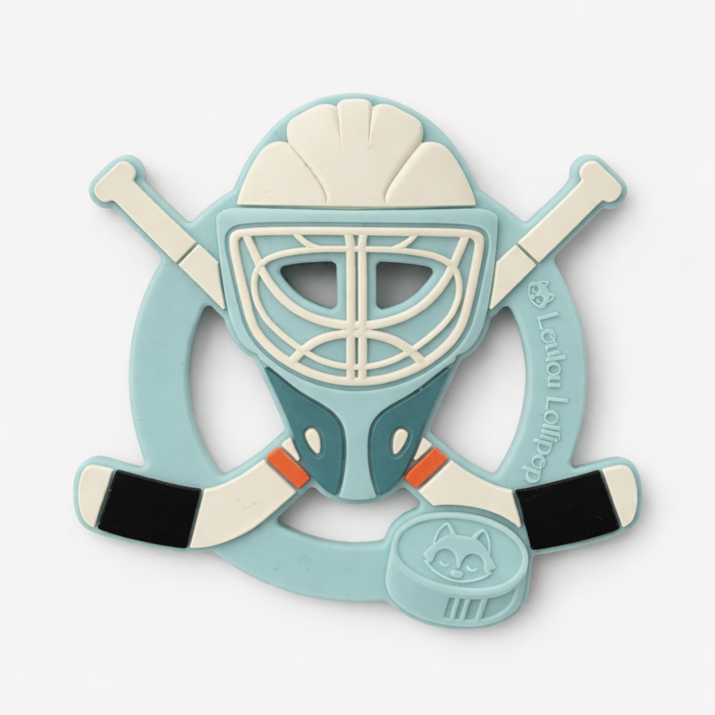Hockey-themed teether with a blue helmet, white face mask, and black and white sticks on a light gray background.