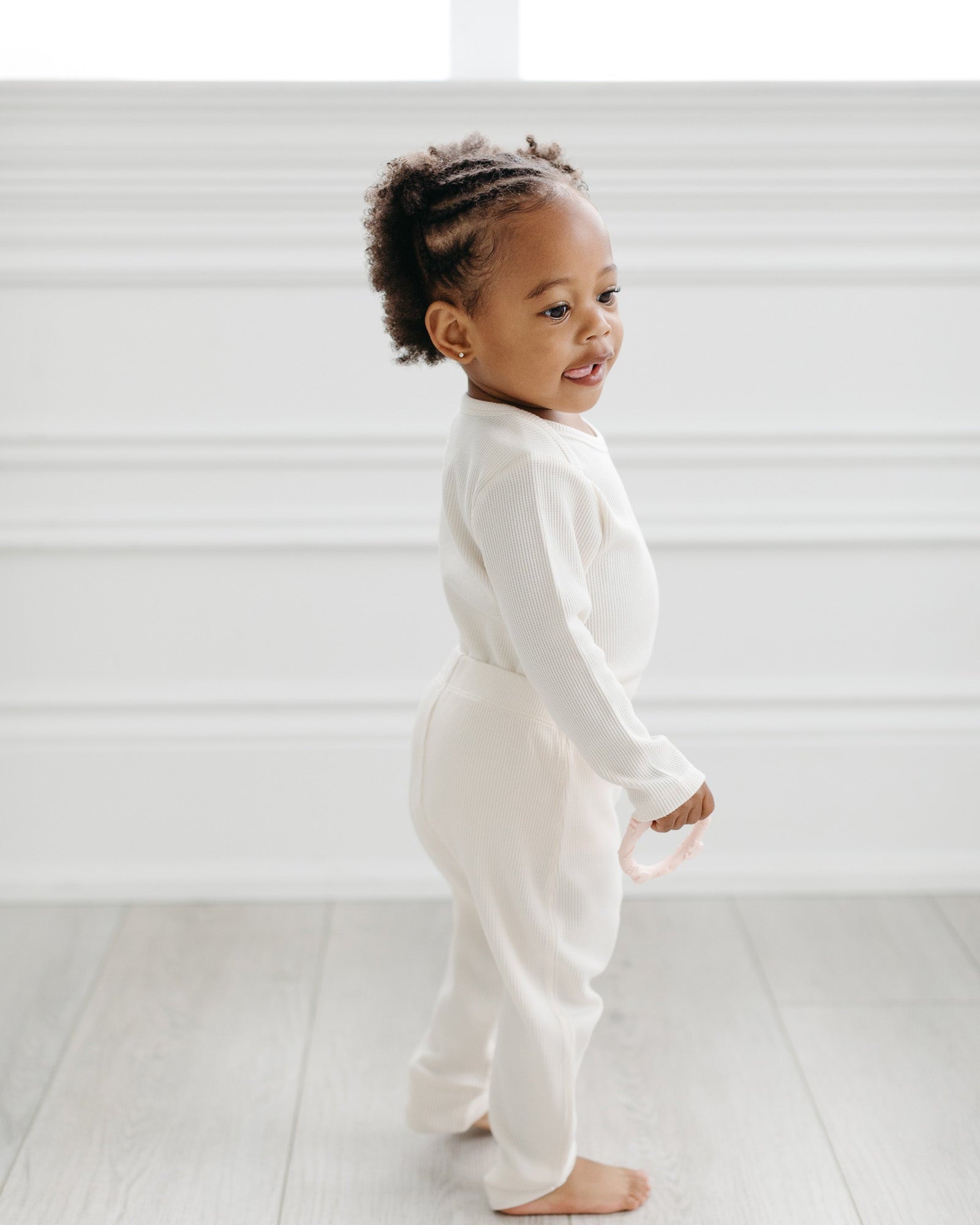 Loulou Lollipop Waffle Long Sleeve Bodysuit in Coconut Milk — front view on white background