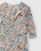 Floral patterned baby romper on a white background