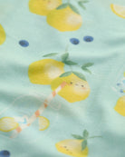 Fabric with lemon pattern on a light green background