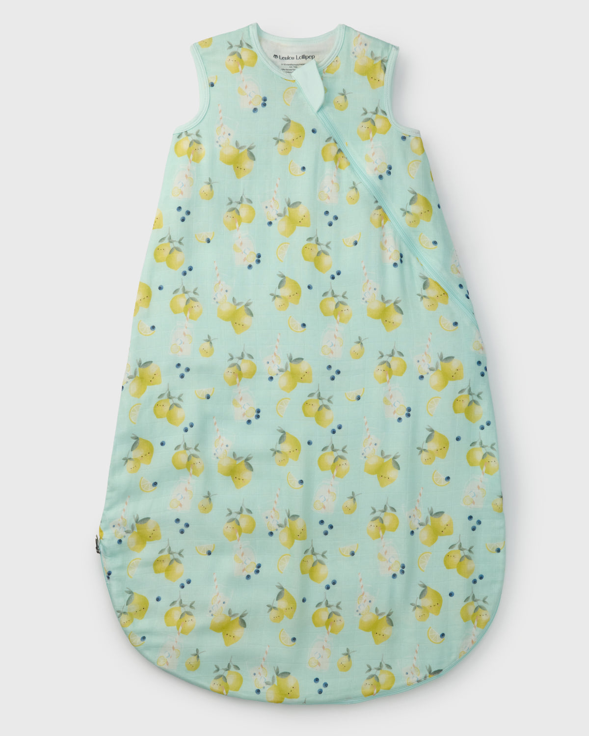 Children's sleeping bag with lemon pattern on a light blue background