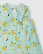 Light blue baby sleep bag with lemon pattern on a white background