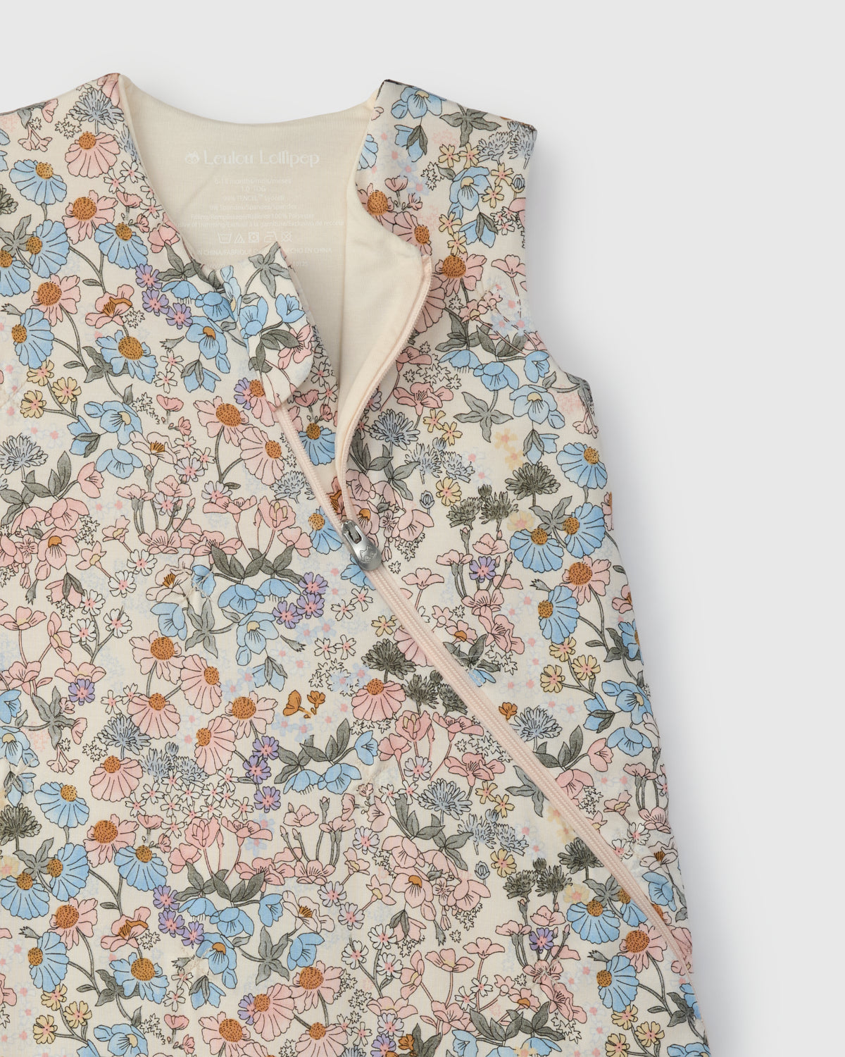 Floral patterned sleep bag on a white background