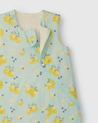 Children's sleep bag with lemon pattern on a light green background