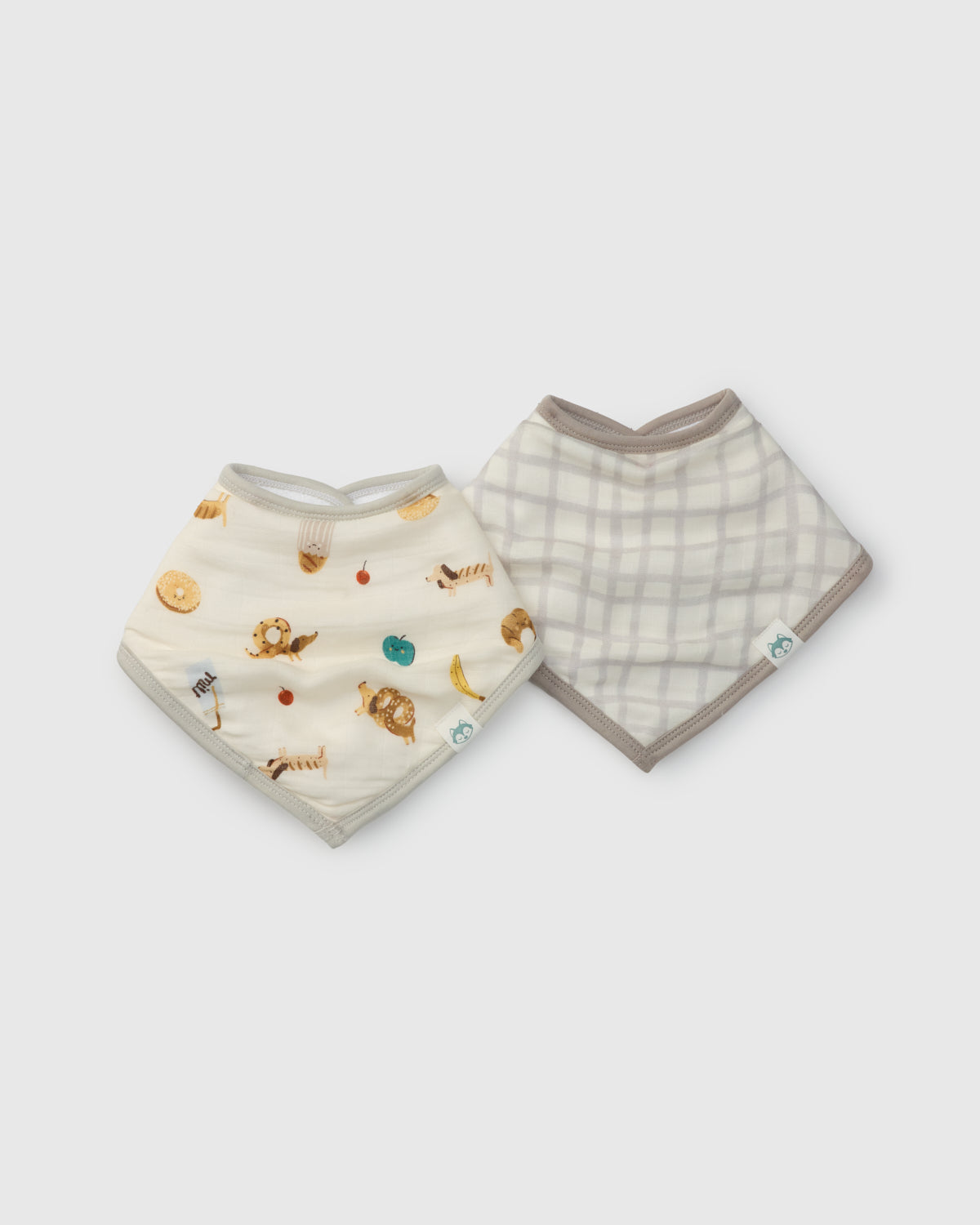 Two baby bibs with different patterns on a white background