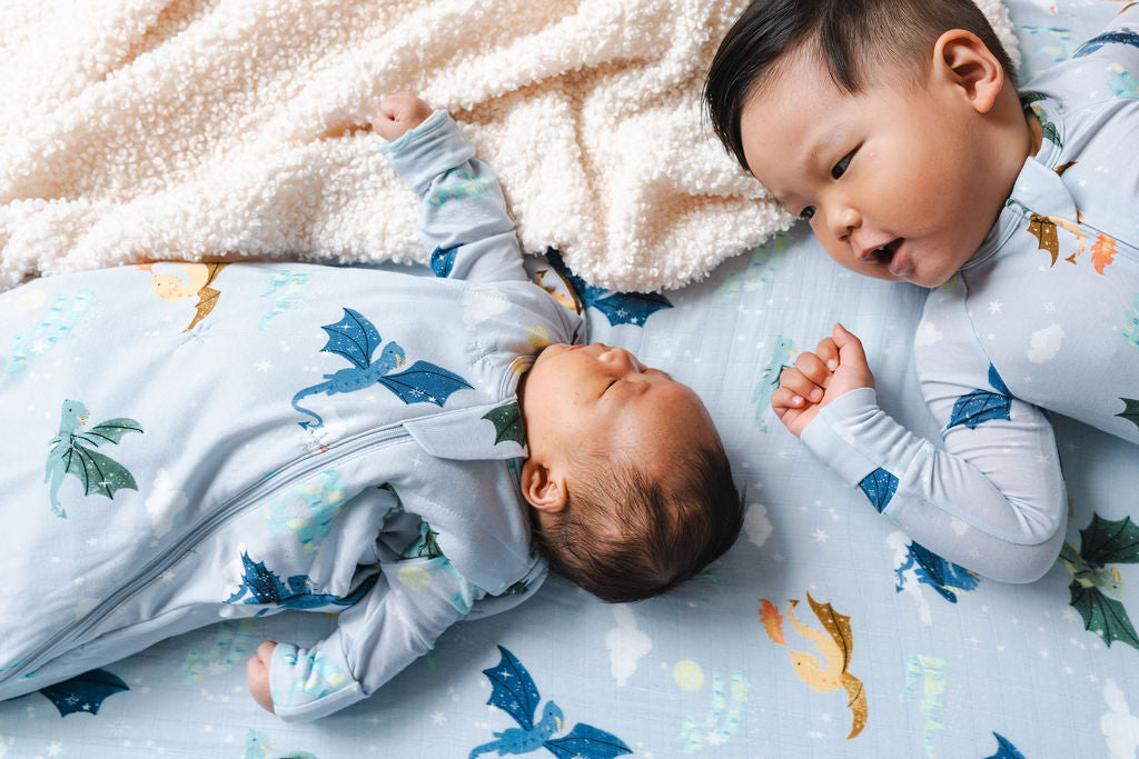 Baby in Sleep Sack with Big Brother in Sleeper in Magical Dragons print.