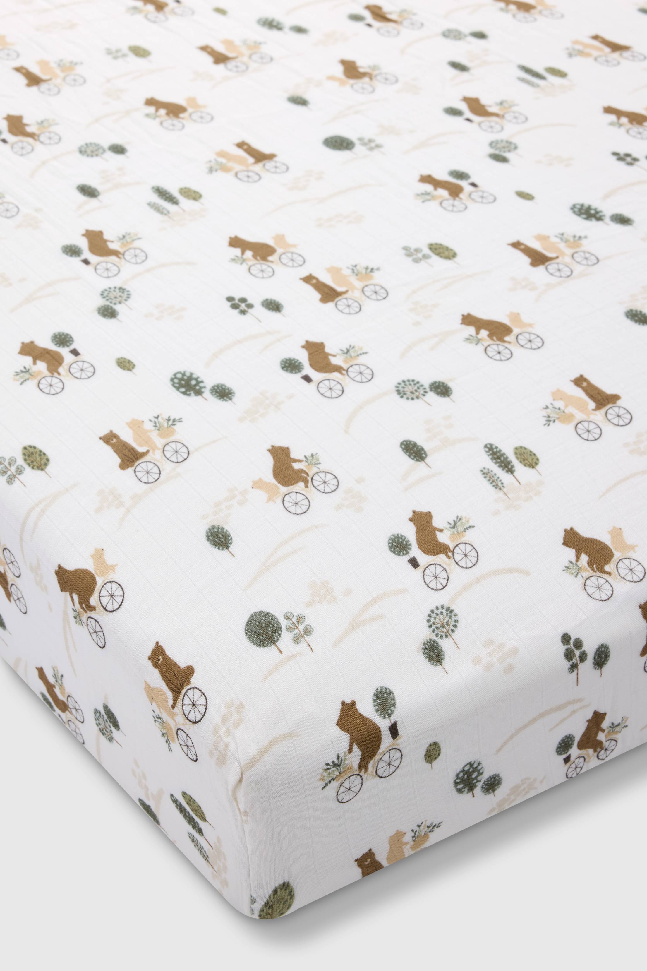 Loulou Lollipop muslin fitted crib sheet in Bears on Bikes for US standard crib — front view on white background
