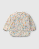 Floral-patterned baby bib on a light gray background