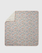 Floral patterned blanket on a light gray background