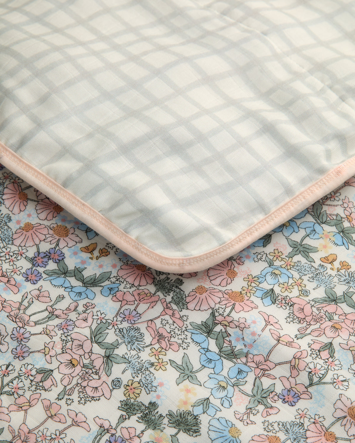 Folded Floral Blanket with a checkered reversible side