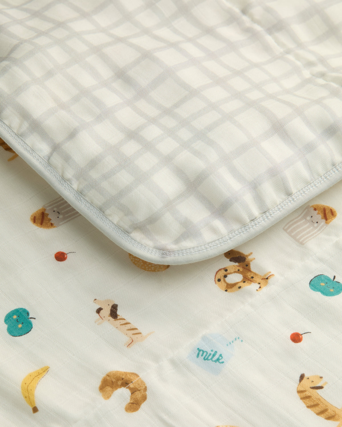 Baby blanket with animal pattern on a plain background