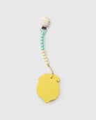 Yellow teething ring with a beaded holder on a white background