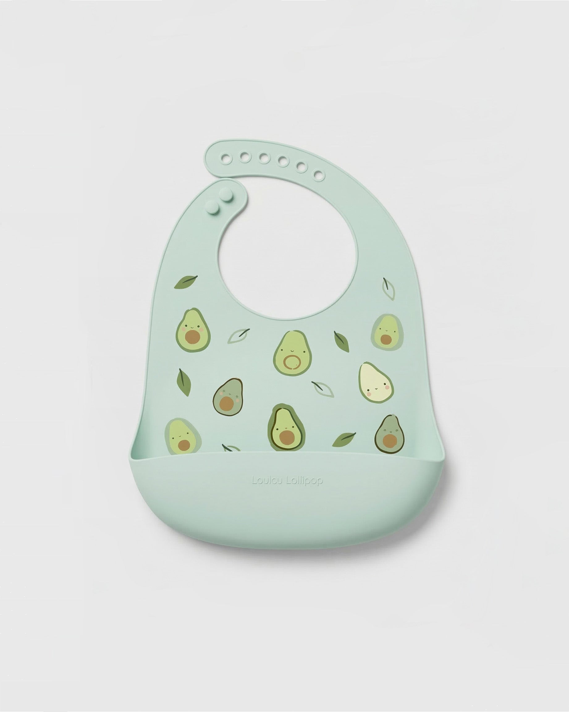 Mint green bib with avocado pattern on a light gray background