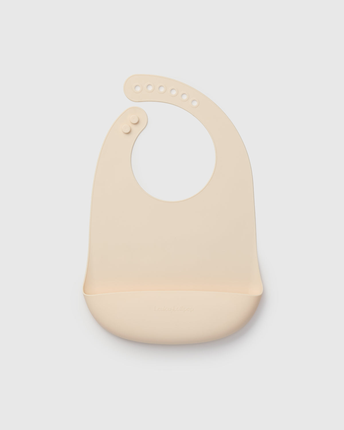 Beige baby bib on a light gray background