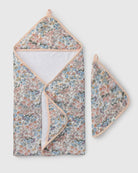 Floral-patterned towel set with a hood and matching pot holder on a light gray background